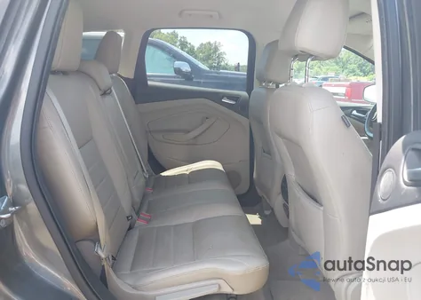 2014 Ford Escape Titanium z USA, uszkodzony, nr VIN 1FMCU0J9XEUC10891